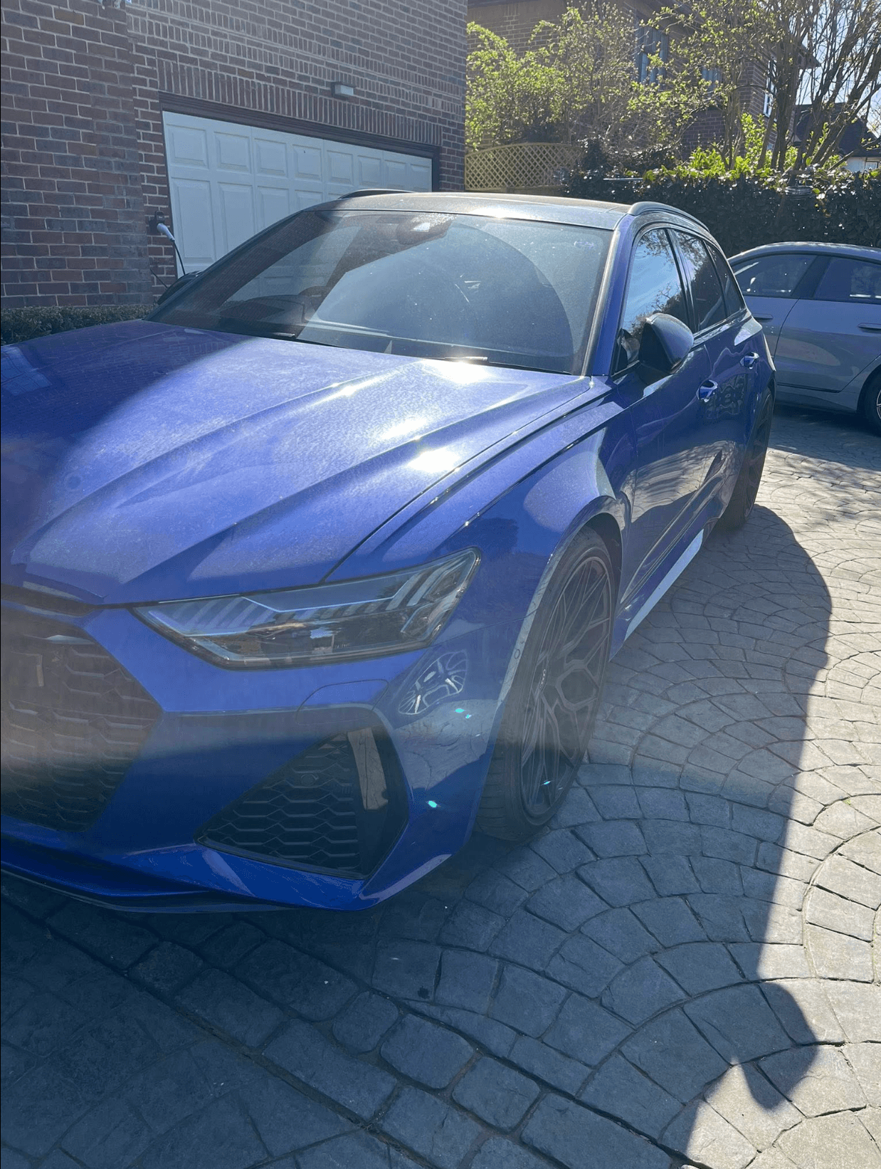 Blue Audi RS6 with a deep ceramic-coated paint finish in an Omaha driveway