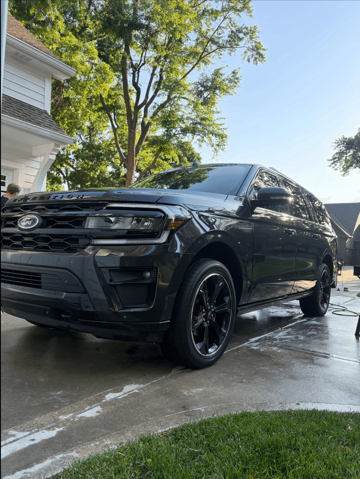 Black Ford Expedition glossy and clean after a full mobile detail in an Omaha driveway