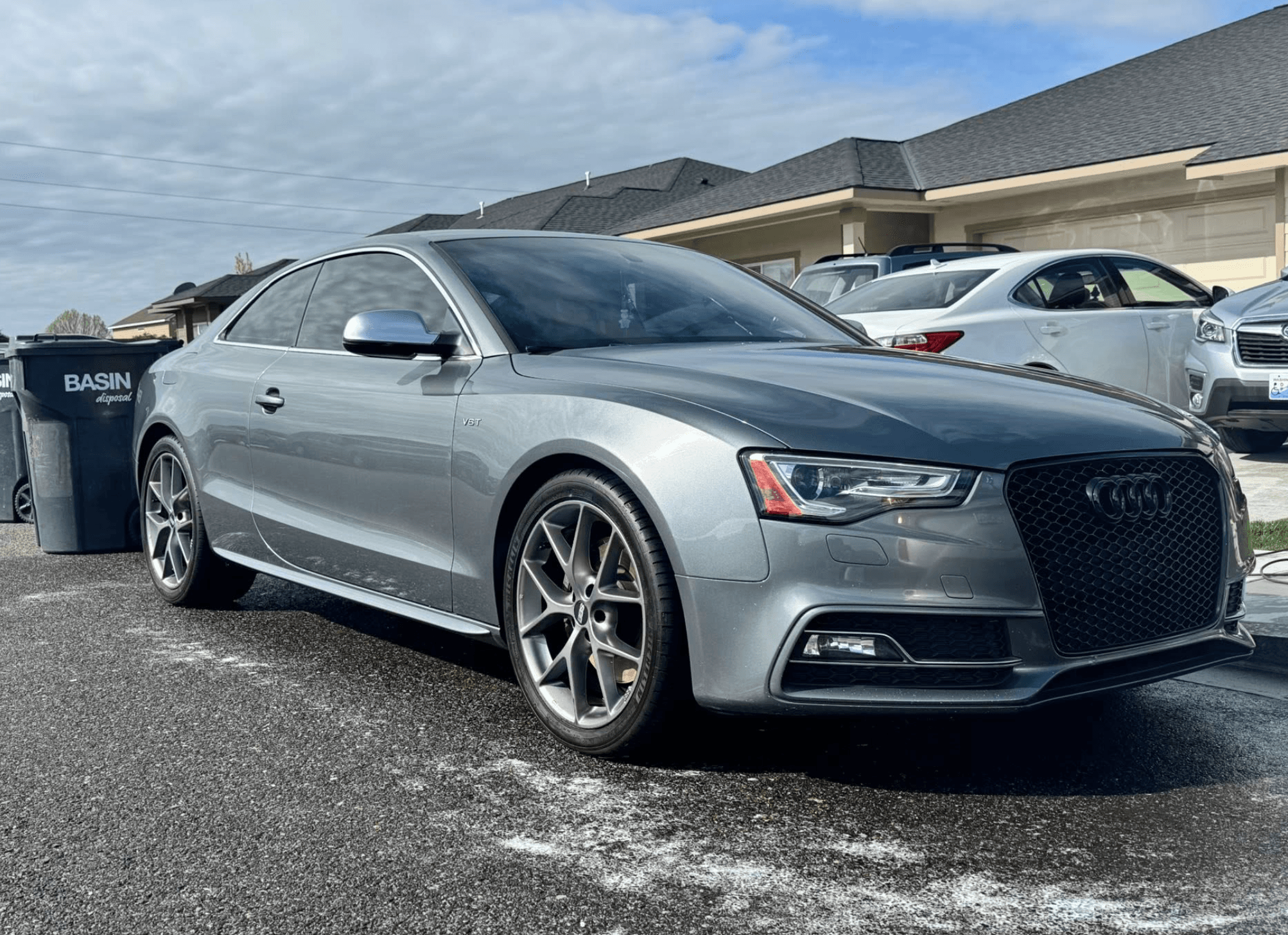 Silver Audi A5 with clear, restored headlights after a mobile detail