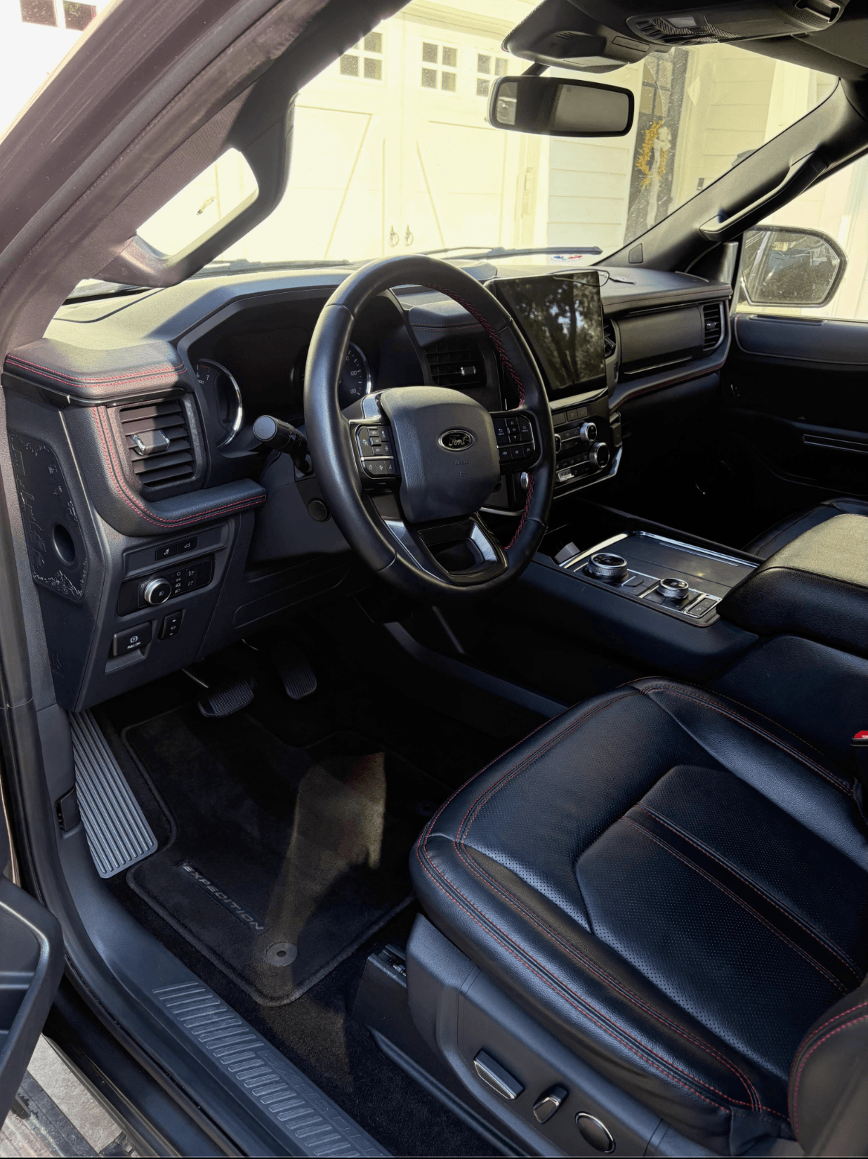 Clean leather interior and dashboard of a Ford Expedition after a deep interior detail